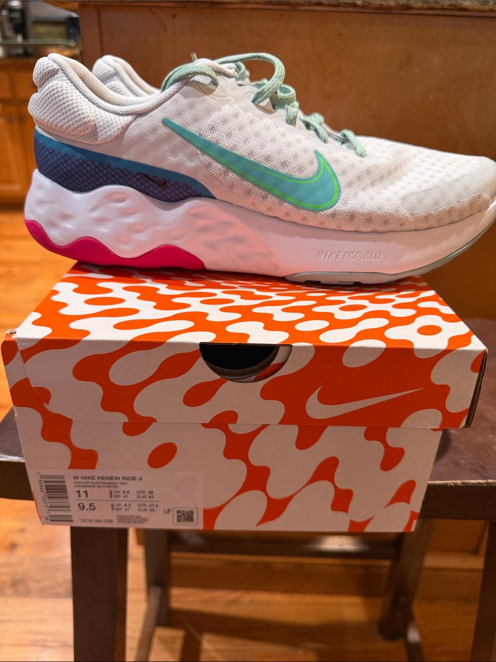 Nike Kids White Sneakers with Teal Swoosh and Pink Heel Accent